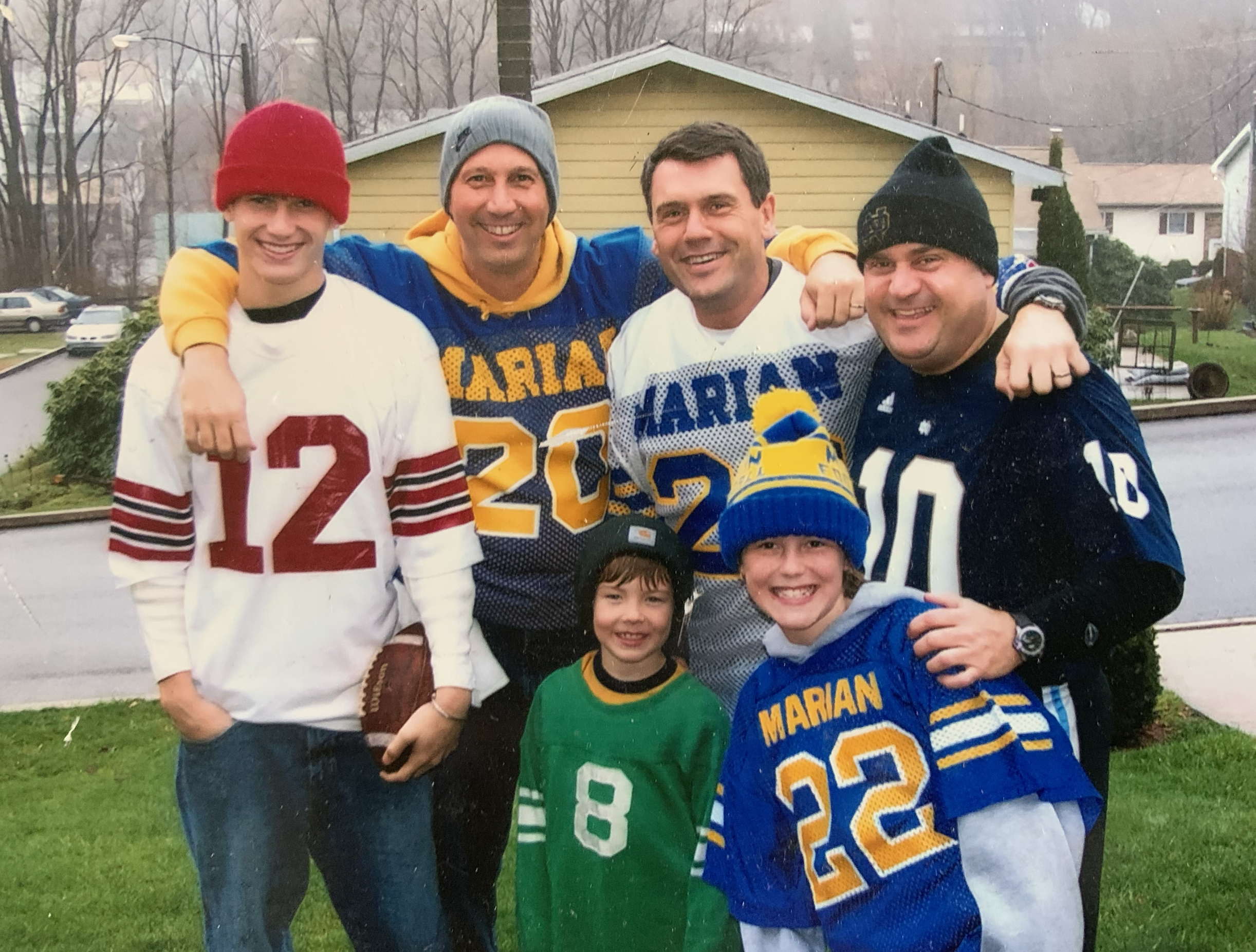 John on a boat, laughing with his family